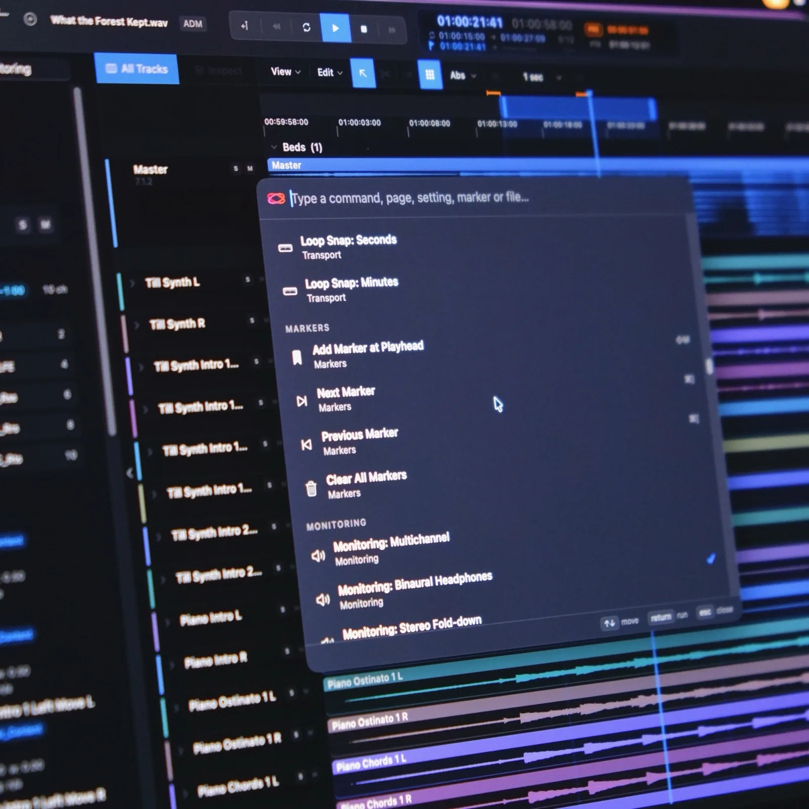 The Command Palette open over the Timeline — Markers and Monitoring groups, with the current monitoring mode ticked